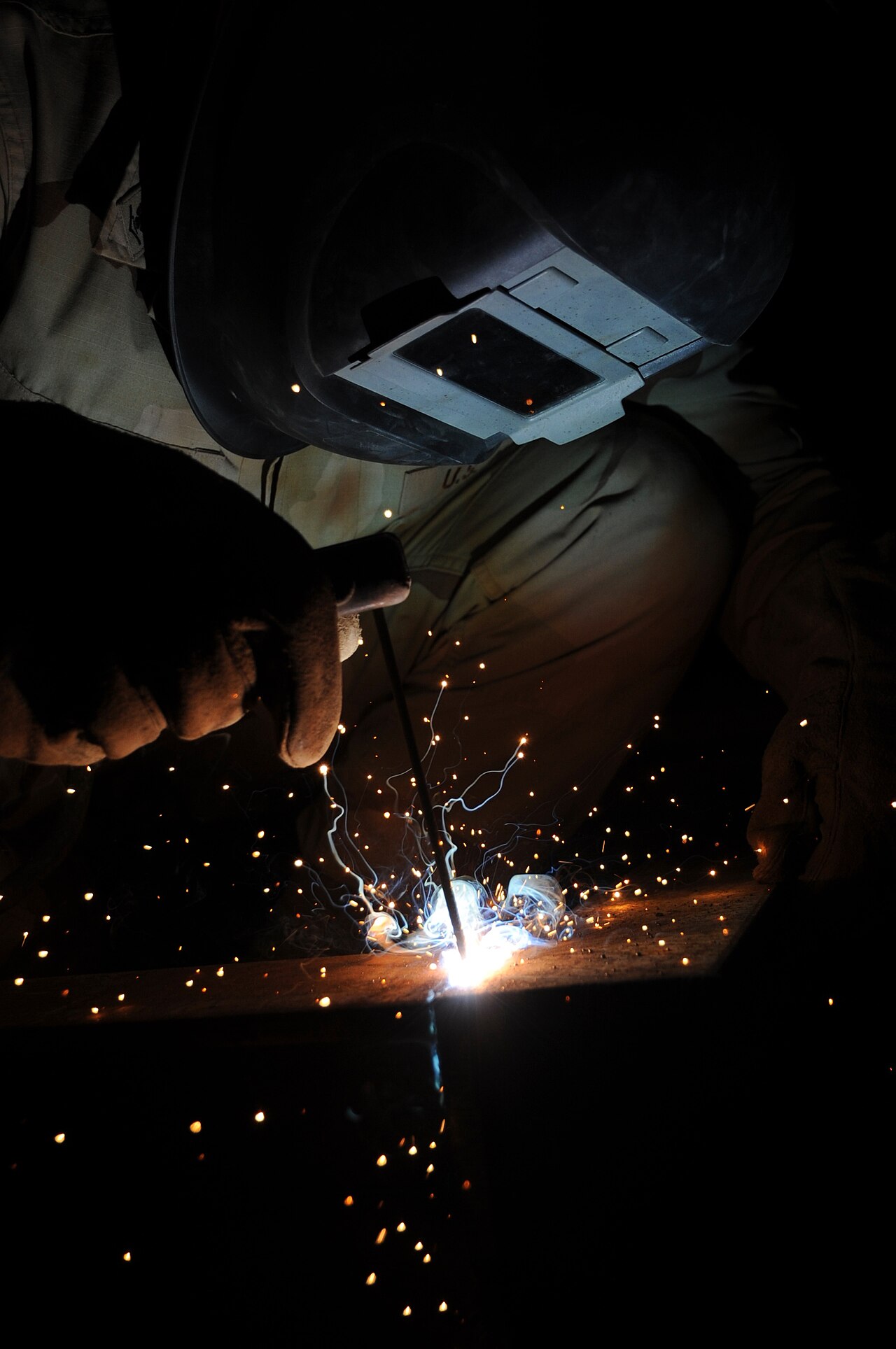 A door frame being welded — the frame is half the security — Photo: U.S. Navy (public domain)